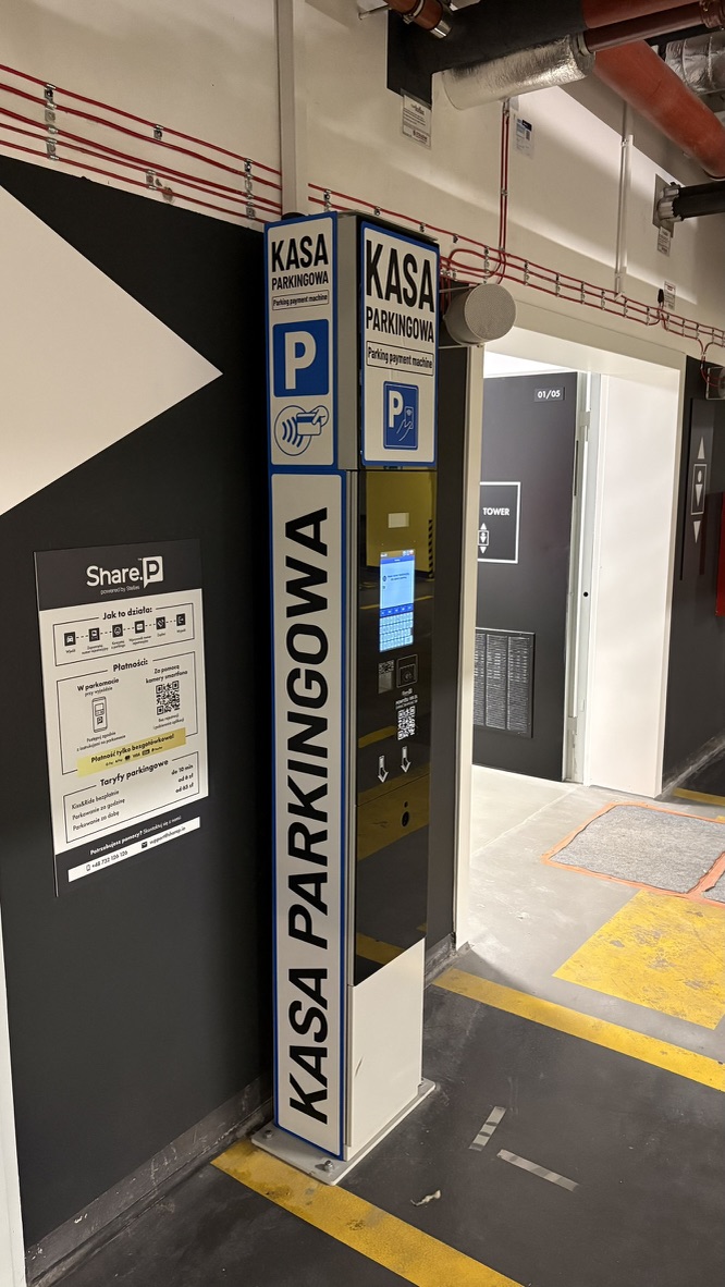 Card payment machine at the V Tower car park with a Share.P instruction sheet