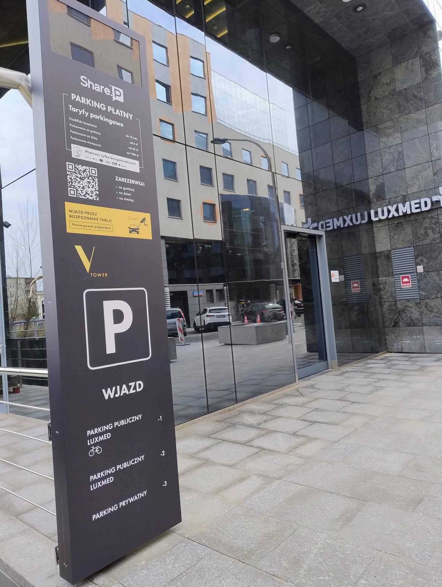 Entrance totem at the V Tower car park showing the parking tariffs